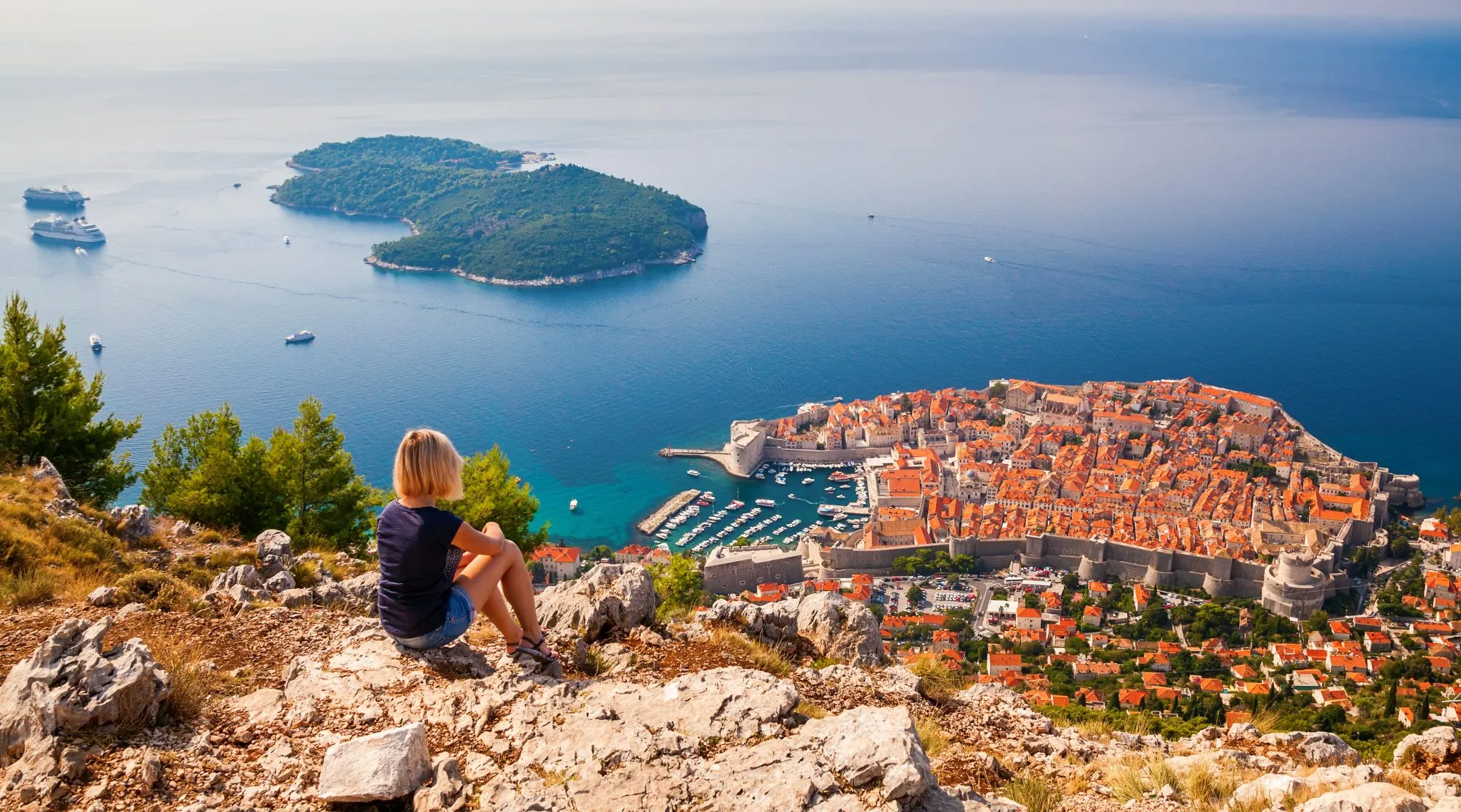 young woman enjoying the view of the Dubrovnik Old Town