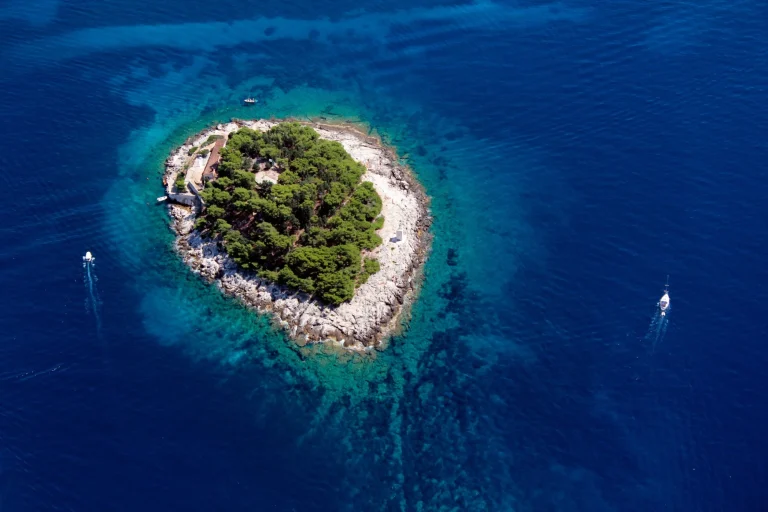 Little Island Galesnik in Adriatic Sea from air. The first in a row of all Pakleni islands, at the very entrance of the port of Hvar.